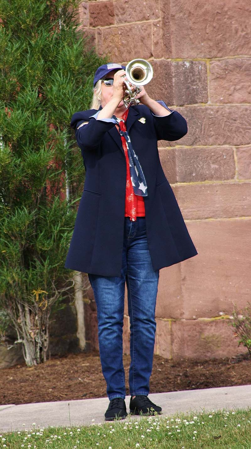 Auxiliary member playing the trumpet